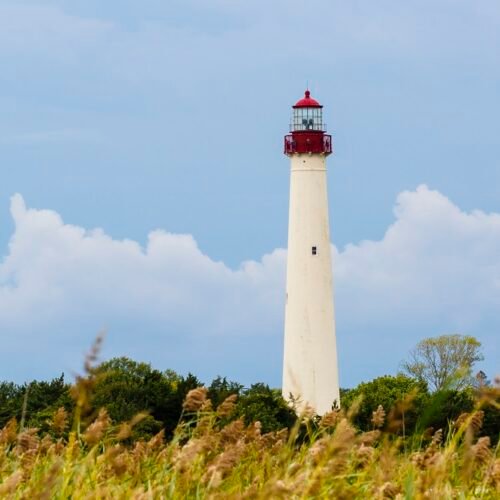 A view of the Cape May NJ lighthouse with storm clouds approaching from the west.